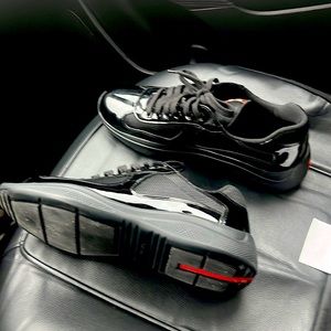 A pair of 100% authentic classic black pradas worn once Have receipt and box